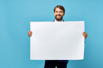 bearded man holding white mockup Poster Copy Space blue background