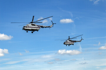 Fototapeta na wymiar a pair of mi 8 helicopters in the sky