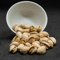 White pistachios in a white bowl