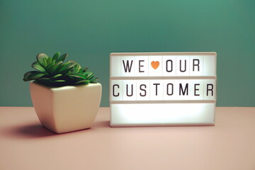 We love our customer word in light box business concept background