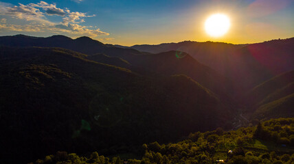 Fototapeta na wymiar splendid sunrise over the hills of the mountains