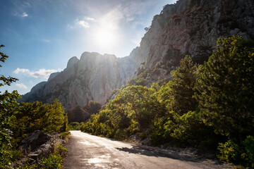 asphalted road in the mountains, beautiful sunshine, summer vacation time
