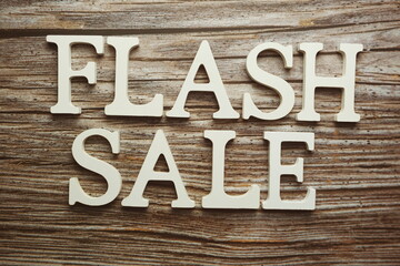 Flash Sale alphabet letter on wooden background