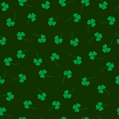 Fototapeta na wymiar Seamless pattern with clover leaves on a green background
