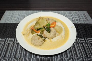 Thai food rice noodle green curry chicken on the table.