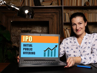  IPO INITIAL PUBLIC OFFERING text on modern laptop screen in office environment.