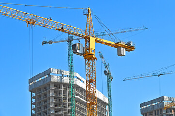 Crane and highrise construction site
