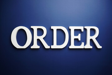 Order alphabet letter on blue background