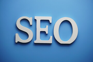 SEO Search Engine Optimization alphabet letter on blue background