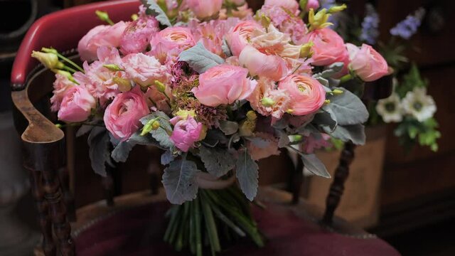 Big bouquet of fresh tea and pink roses in flower shop. Natural floral composition for holiday or festive event