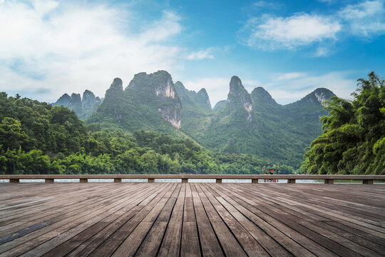 Wooden plank road and green mountains and green water natural landscape
