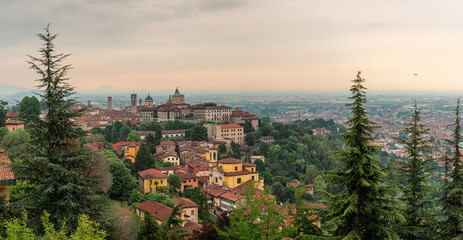 Fototapeta na wymiar Panoramic view on old city Citta Alta of medieval town Bergamo, Lombardy, Italy on sunrise. Travel destination