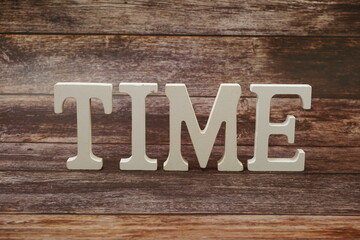 Time Word alphabet letters on wooden background