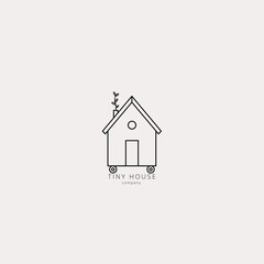 Vector illustration of tiny little house in linear style. Eco green home on wheels. Logo, emblem, icon, badge design template.