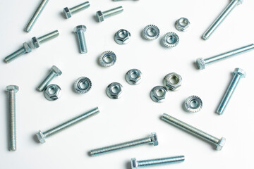 technological background of metal bolts and nuts close up