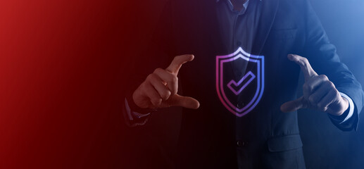 Protection network security computer in the hands of a businessman. business, technology, cyber security and internet concept - businessman pressing shield button on virtual screens Data protection