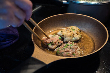 Delicious fried fish cakes closeup in the kitchen.