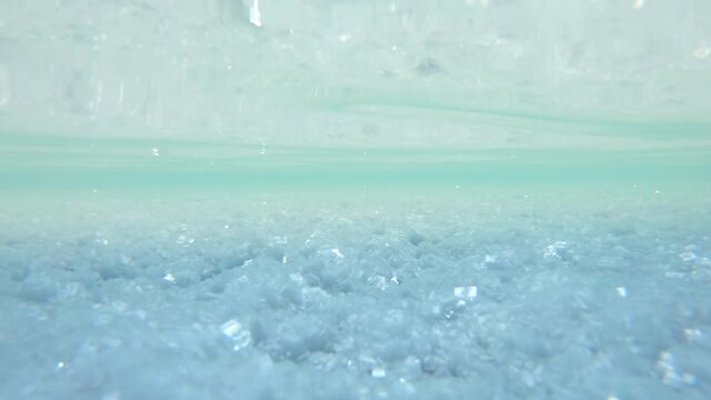 Underwater view of the salt crystals of Uyuni salt flat in Bolivia