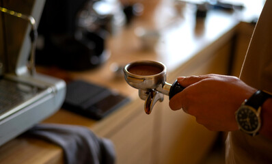 Fototapeta na wymiar Close up Espresso coffee machine piston on blurred background.Photo select focus.