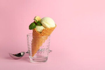 Glass with tasty banana ice cream on color background