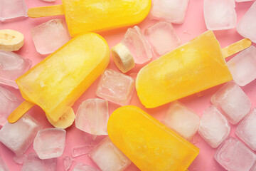 Tasty banana ice cream and ice cubes on color background