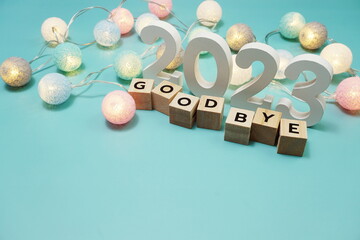 Goodbye 2023 alphabet letters with space copy on blue background