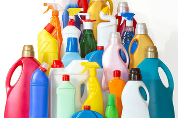 A lot of bottles with chemicals for cleaning. Different plastic bottles in the form of mountain. Pile of many colorful bottles on the white background