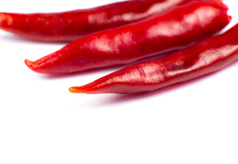 Red hot chili peppers on white background. Close up.