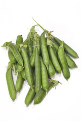Pods of green peas with leaves isolated on white background
