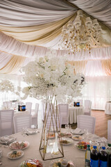 wedding table in a restaurant with decor and food