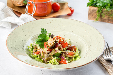Eggplant salad in white plate filmed for menu