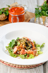 Eggplant salad in white plate filmed for menu
