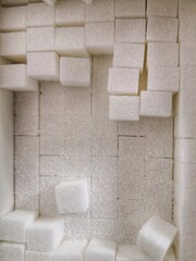 directly bove view of sugar cubes in box