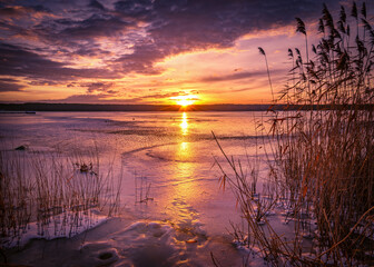 Beautiful sunset on the frozen winter lake, zalew zemborzycki lublin poland © RafalDlugosz
