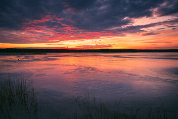 Beautiful sunset on the frozen winter lake, zalew zemborzycki lublin poland - obrazy, fototapety, plakaty
