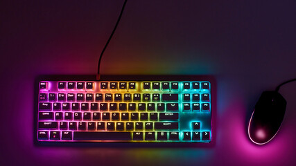 Gaming keyboard with RGB light. White mechanical keyboard and mouse with backlight. Colorful keyboard and mouse with RGB backlight. Gamer's Workspace - Powered by Adobe