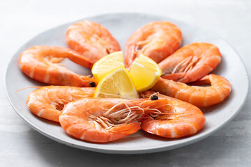 cooked shrimps with lemon on the dish