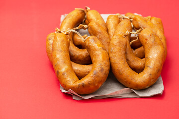 typical portuguese smoked sausages alheira on ceramic background