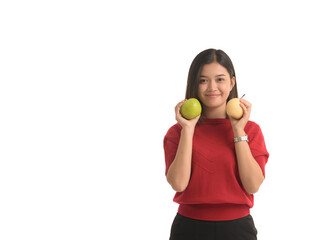 Asian woman is holding an apple with both hands attached to her chest, on white background.