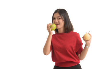 Asian woman is holding an apple with her right hand and look interesting on white background.
