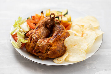 typical portuguese smoked sausage alheira with chips and greens