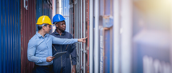 Manager and staff worker inspecting shipping containers for import and export cargo.