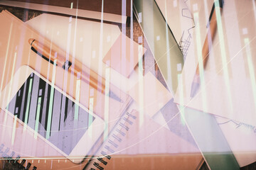 Multi exposure of forex graph hologram over desktop with phone. Top view. Mobile trade platform...