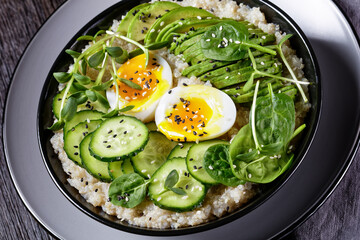 quinoa bowl with greens, avocado and boiled egg