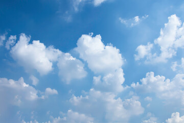 Naklejka na ściany i meble Soft white clouds in the blue sky