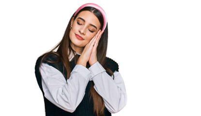 Fototapeta premium Young beautiful woman wearing casual white shirt sleeping tired dreaming and posing with hands together while smiling with closed eyes.