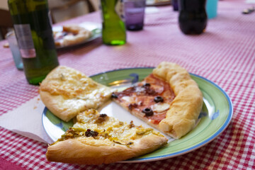 eating pizza on a laid table