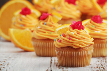 Cupcakes with orange icing on top