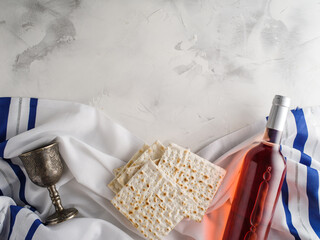 Top view of matza and kosher wine and wineglass, jewish Passover holiday concept. - 415345332