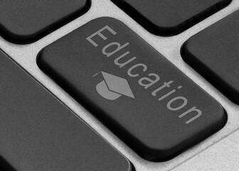 Laptop button with the inscription and with the image of a student degree hat.
